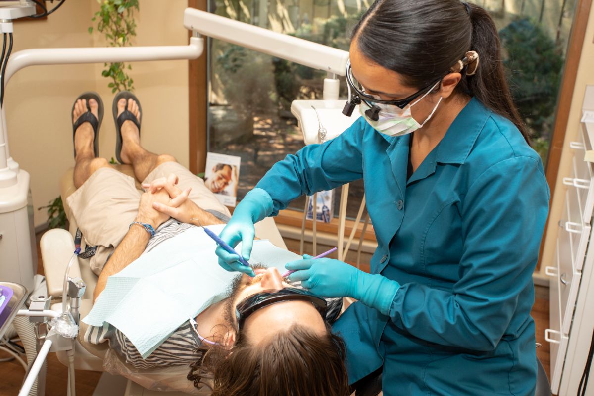 Busk dental assistant working on a patient
